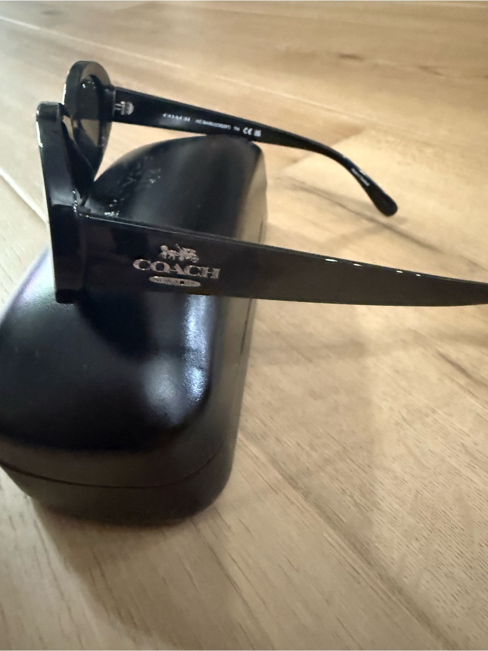 Coach Women's Black Oval Sunglasses with Dark Lenses - Picture 7 of 11